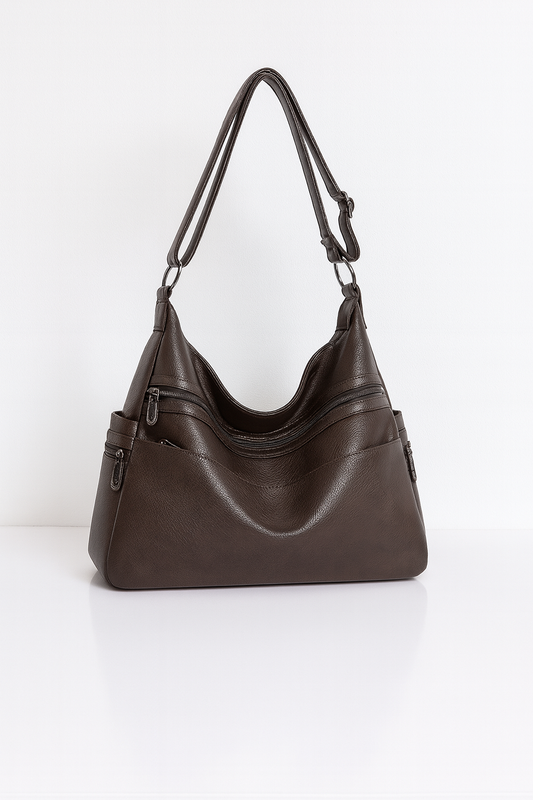 Stijlvolle handtas van hoogwaardig PU-leer met meerdere handige vakken, afgebeeld in de kleur espresso. De tas heeft een elegant design met ritssluitingen en verstelbare schouderbanden, en is ook verkrijgbaar in blauw.