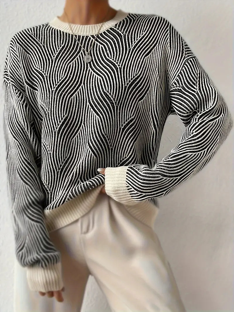 Allegra trui met abstract patroon in zwart en wit – een stijlvolle en veelzijdige must-have voor elke garderobe. Met een comfortabele pasvorm en tijdloos kleurenpalet biedt deze trui moderne elegantie en gezellige warmte. Perfect voor werk, casual uitjes of gezellige avonden. Combineer eenvoudig met broeken, rokken of jeans voor een chique look. Verkrijgbaar in zwart/wit, maten S-XL. Voeg verfijning en comfort toe aan je outfits met de Allegra. Bestel nu!