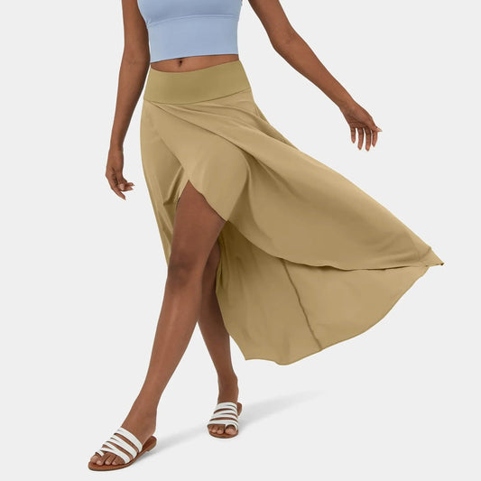 Libra | Elegante Gespleten Maxi Rok - Voeg stijl en comfort toe aan je garderobe met de Libra maxi rok. Ideaal voor elk seizoen dankzij het high-low ontwerp, ruches voor extra volume, en een elegante maxi-lengte. Perfect voor kantoor, avondjes uit of casual dagen. Gemaakt van duurzaam polyester in diverse kleuren: Khaki, Oranje, Roze, Blauw, Vermiljoen en Wijn. Verkrijgbaar in maten XS-XL. Upgrade je looks met deze tijdloze must-have!