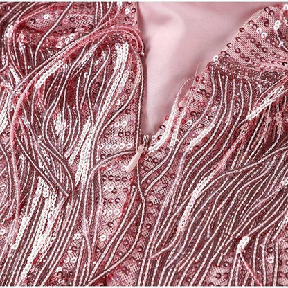 Calla | Elegante cocktailjurk met pailletten en veren